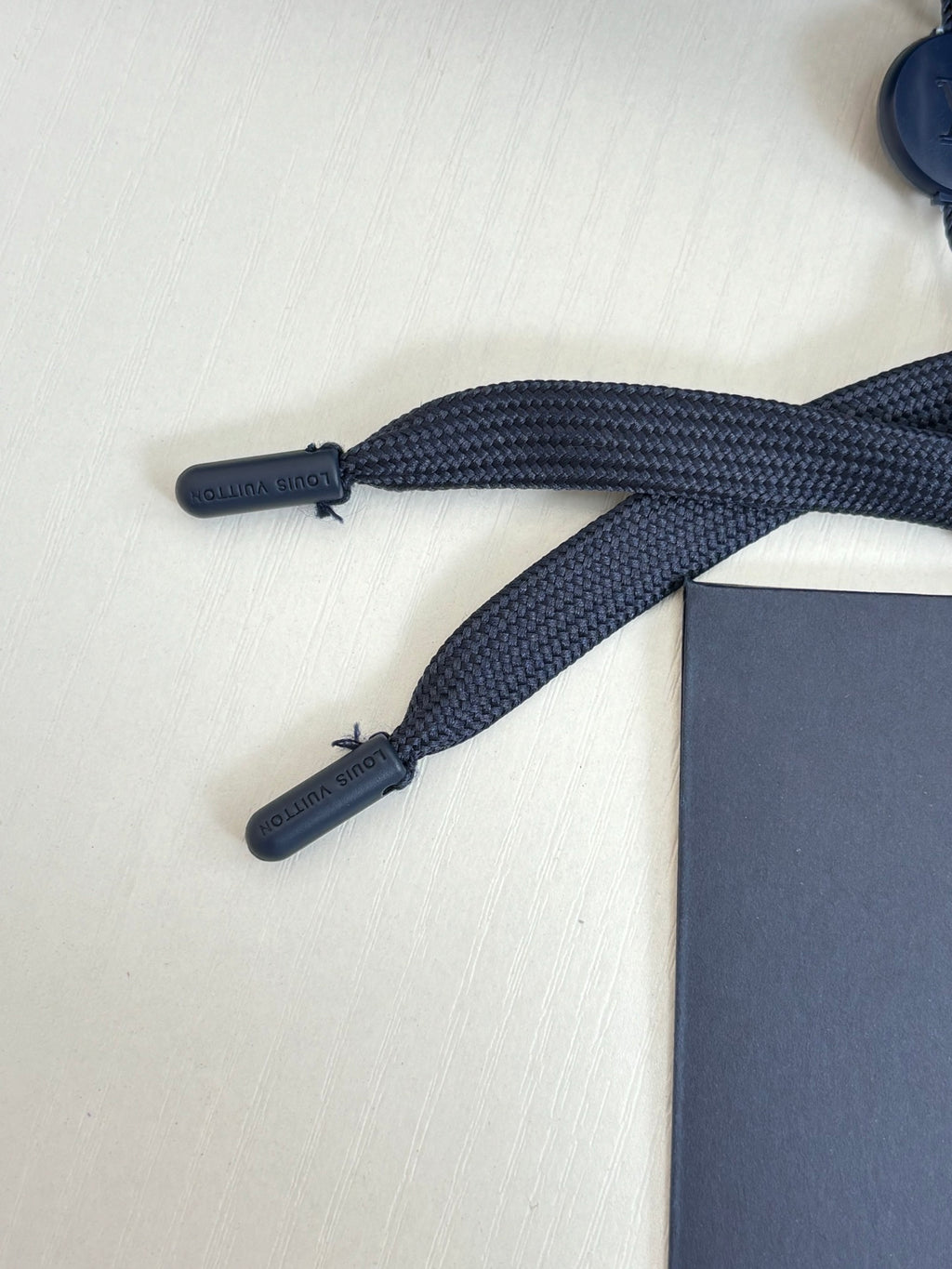 Navy drawstring ends and cords for shorts, with embossed branding