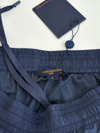 Navy shorts inner waistband with Louis Vuitton logo tag, size S