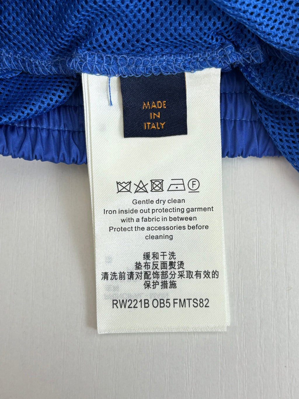 Blue pants waistband with Louis Vuitton care label