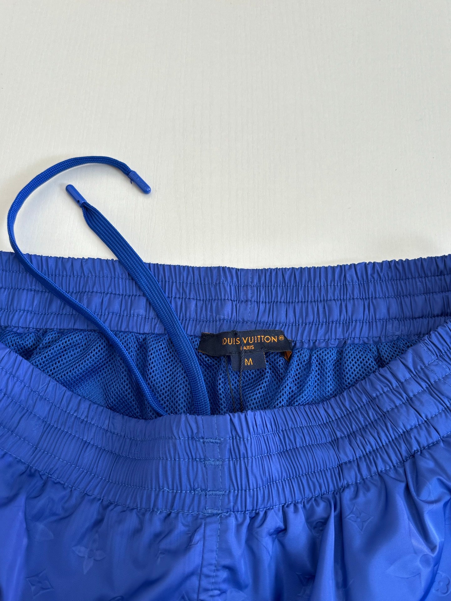 Blue shorts with elastic waistband and Louis Vuitton size label