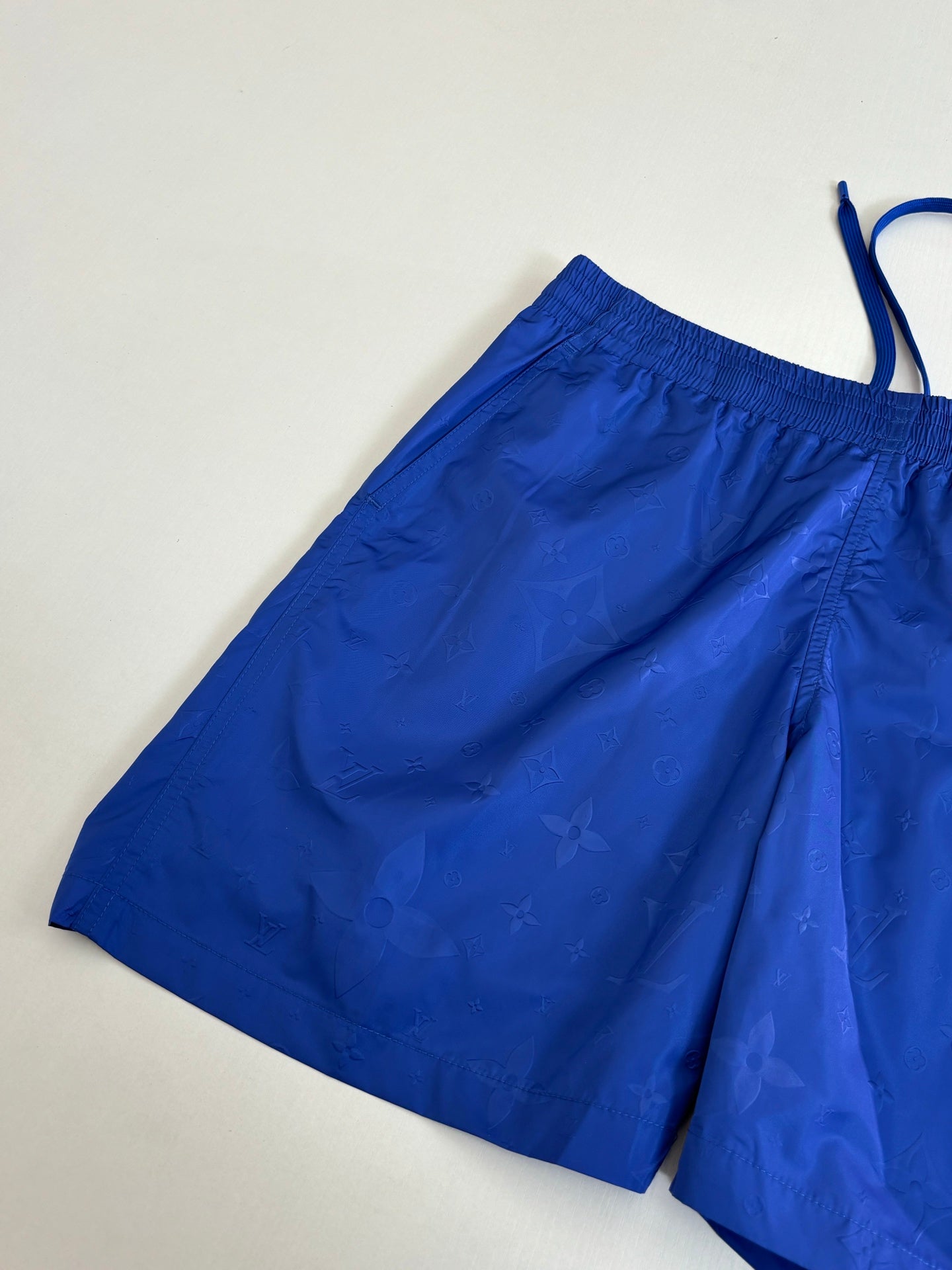 Blue shorts with embossed pattern and elastic waistband