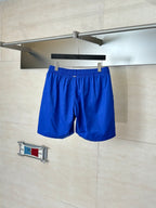 Blue shorts with elastic waistband and front pleated drape
