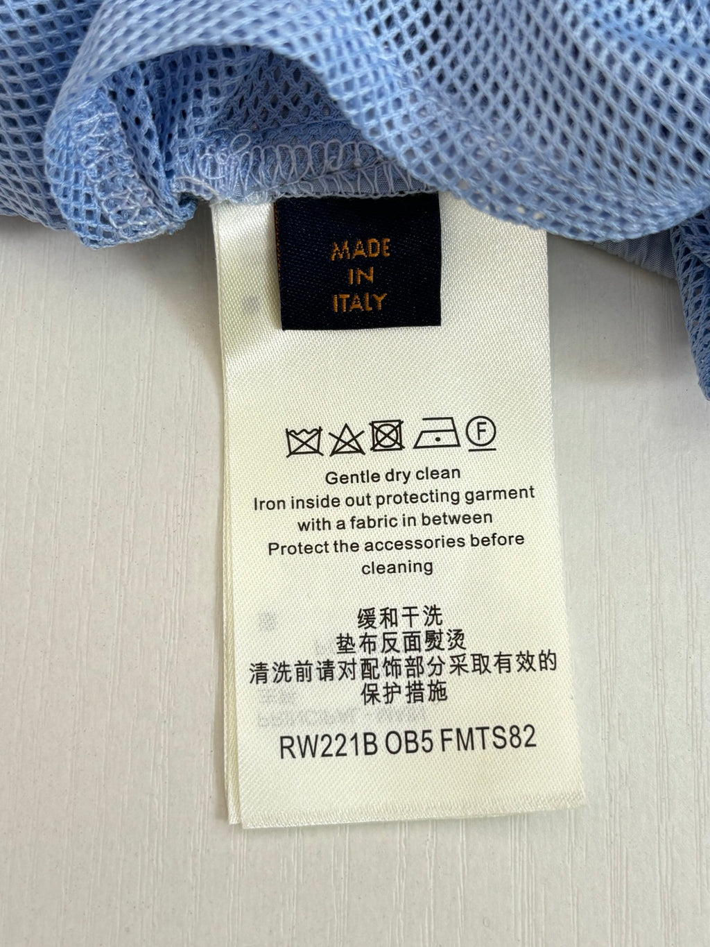 Pants care label tag attached to waistband