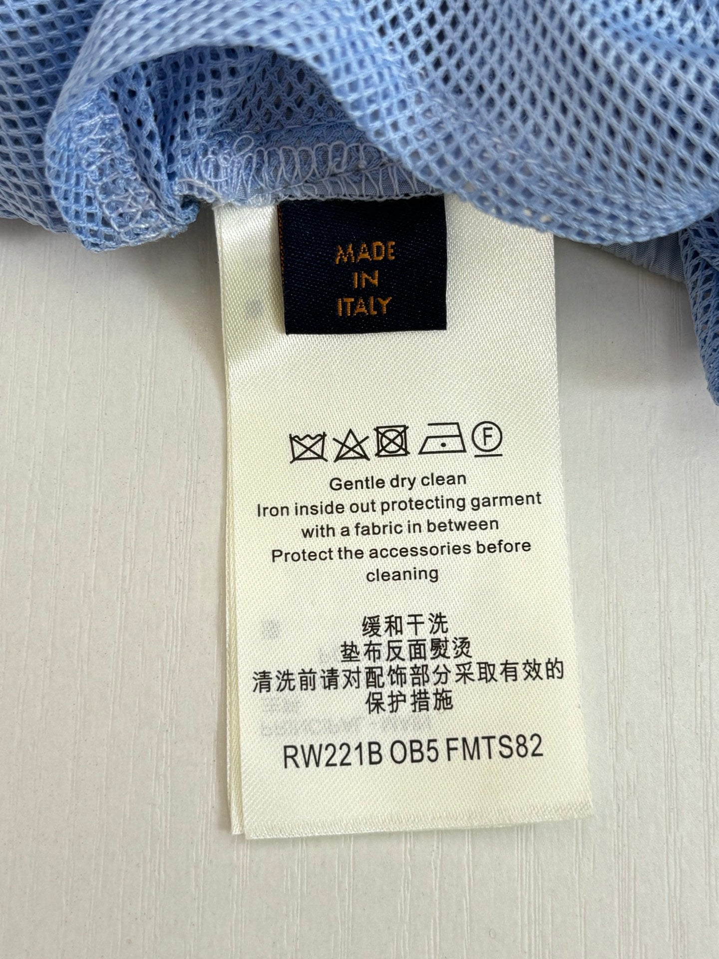 Pants care label tag attached to waistband