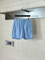 Light blue monogram shorts with elastic waistband and drawstring tie