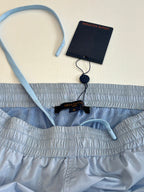 Light blue monogram shorts with waistband, drawstring, and Louis Vuitton label