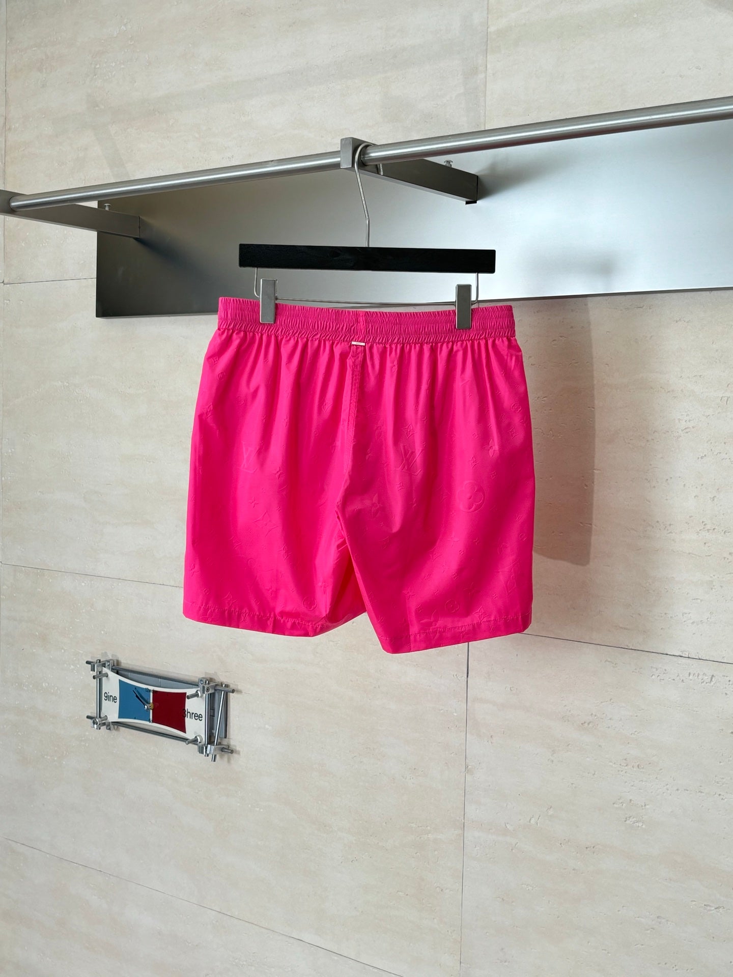 Hot pink elastic-waist shorts with drawstring and relaxed fit