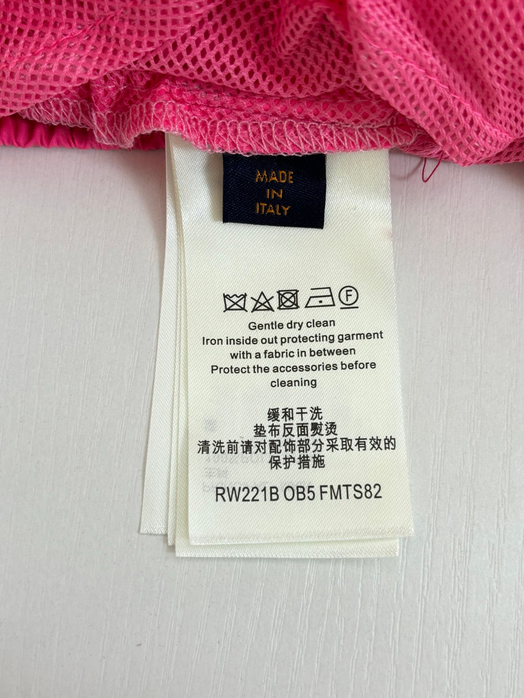 Pants care label with Made in Italy and cleaning instructions