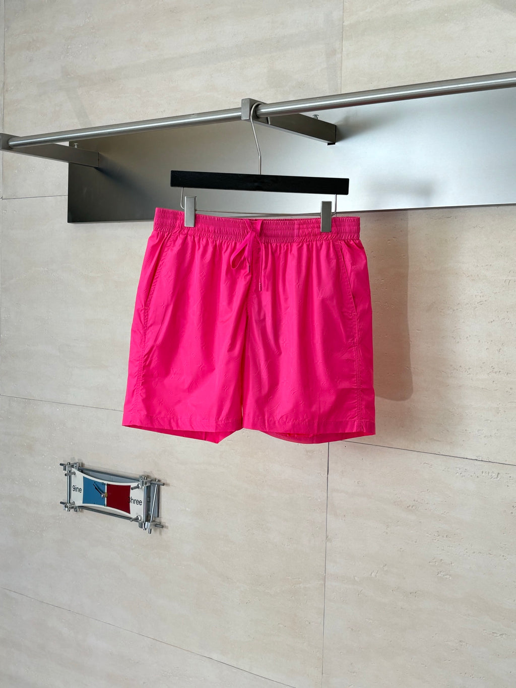 Pink drawstring shorts with elastic waistband and side pockets