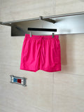 Pink drawstring shorts with elastic waistband and side pockets