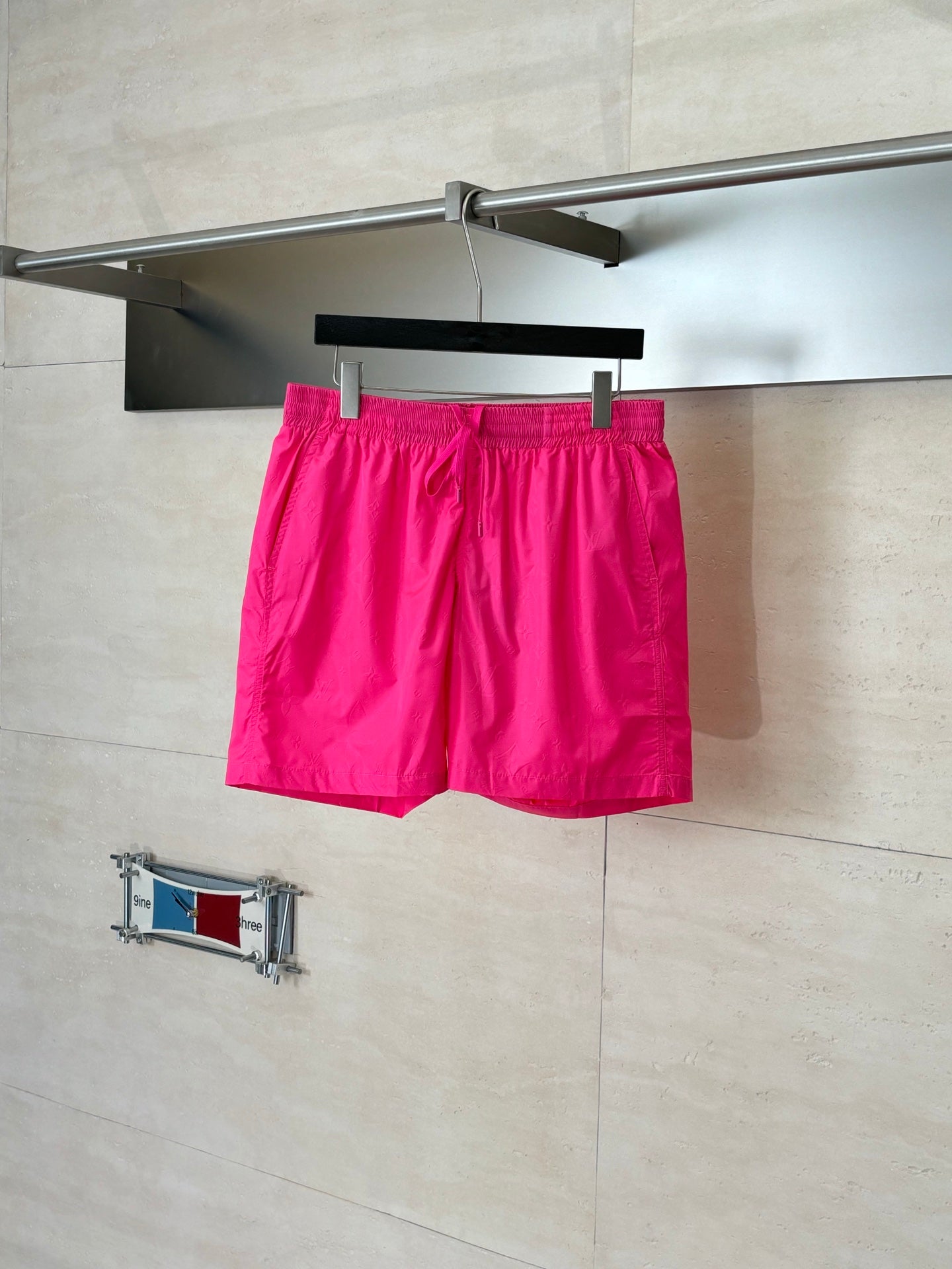 Pink drawstring shorts with elastic waistband and side pockets