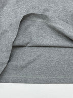 Grey T-shirt shoulder and hem stitching detail