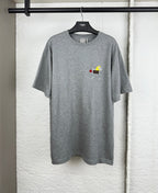 Grey crew-neck T-shirt with short sleeves and small cartoon logo chest print