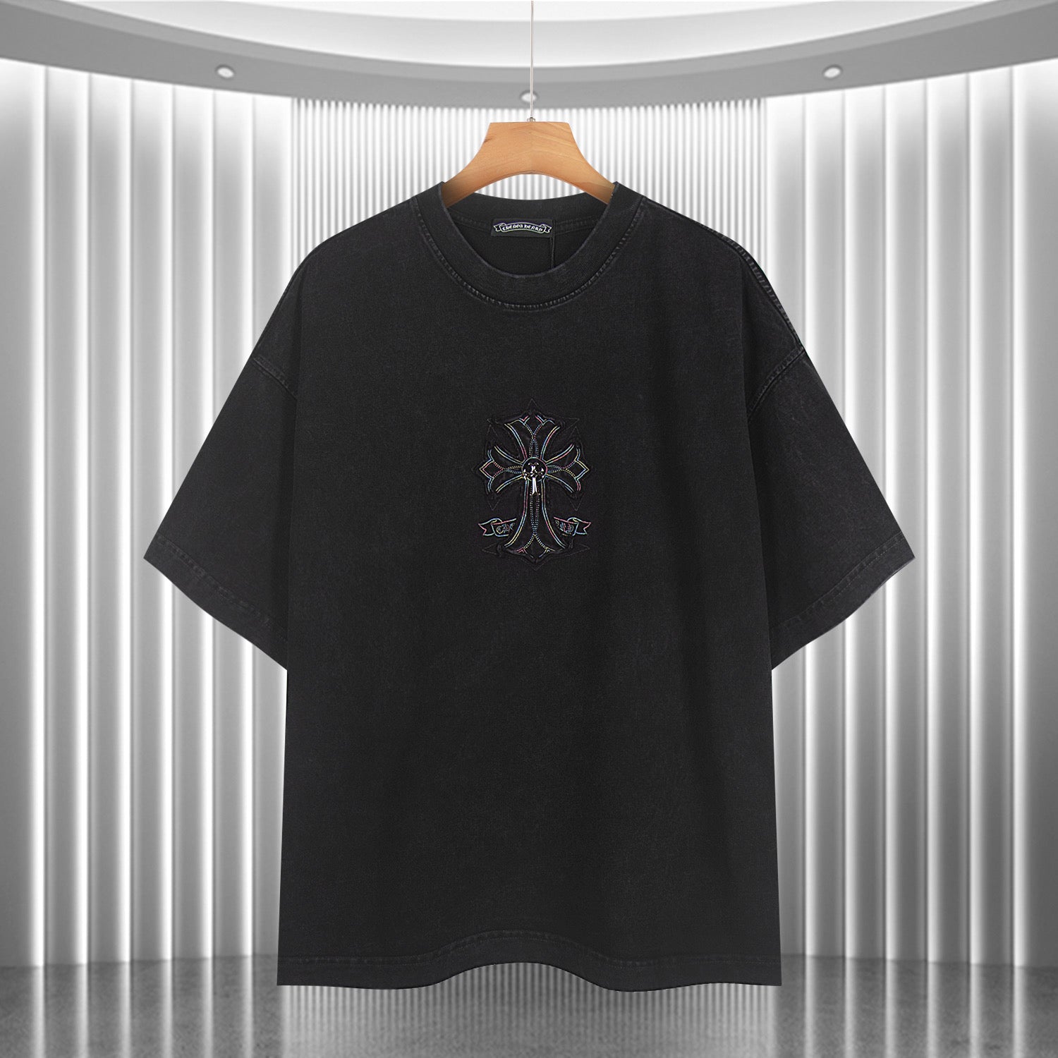 Black short-sleeve T-shirt with small front emblem graphic