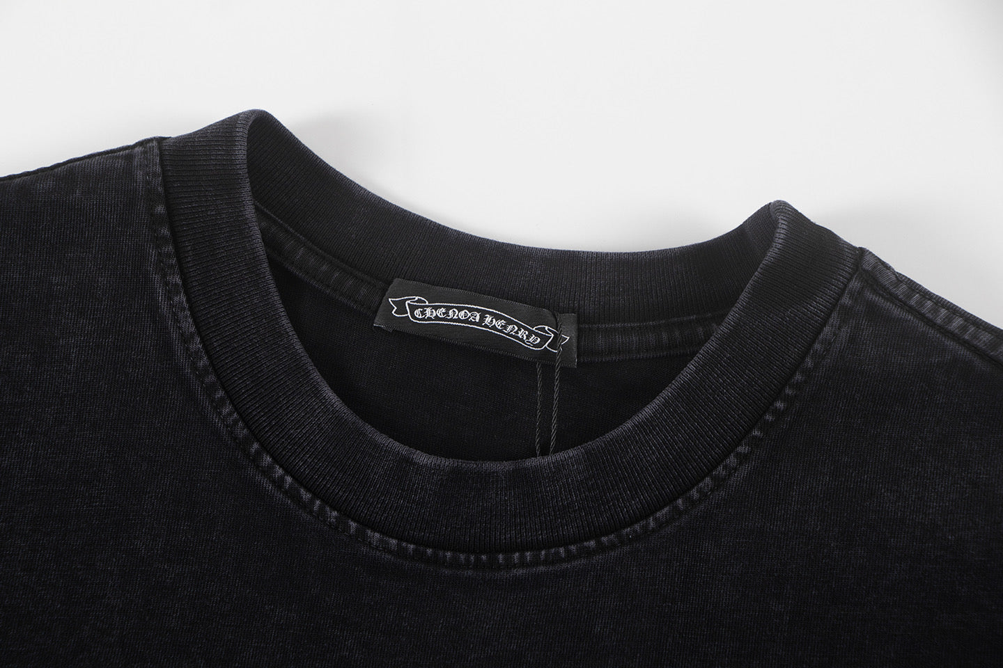 Black crew-neck short-sleeve T-shirt with interior brand label