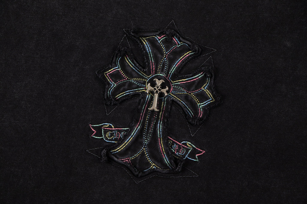 Close-up of cross-flower emblem graphic on black T-shirt
