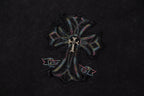 Close-up of cross-flower emblem graphic on black T-shirt