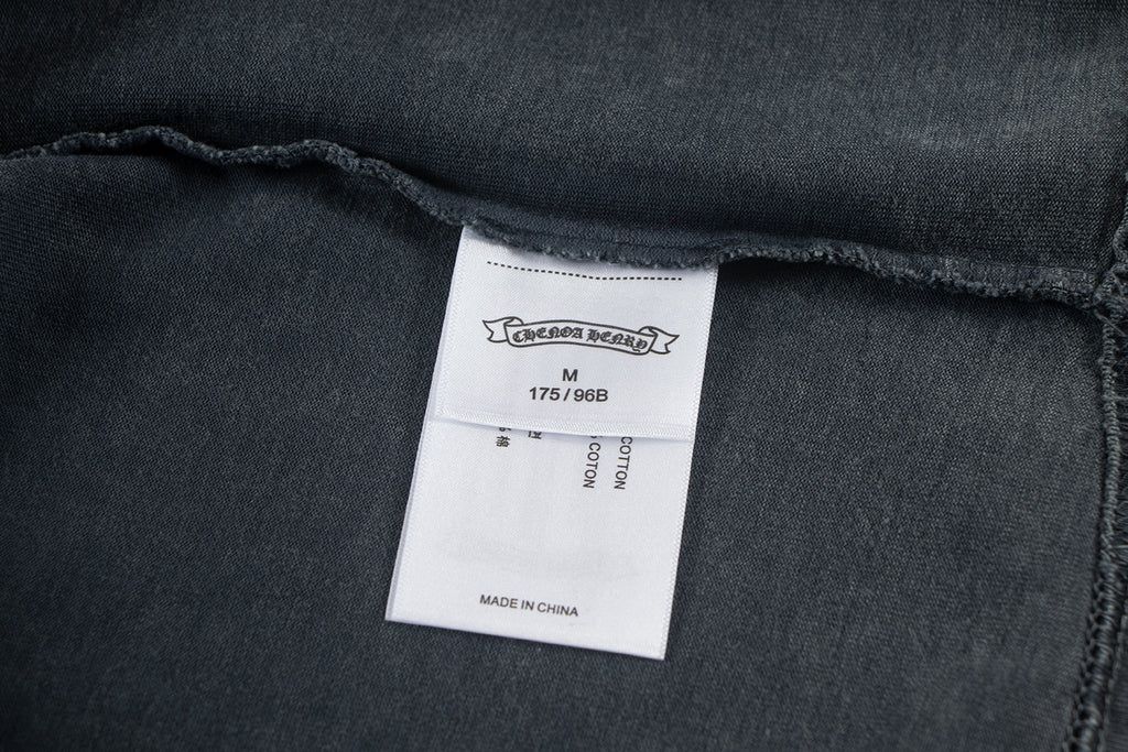 Dark T-shirt inner neck label with size M and made in China
