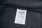 Dark T-shirt inner neck label with size M and made in China