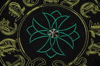 Embroidered-style teal flower center with gold ornamental patterns on T-shirt