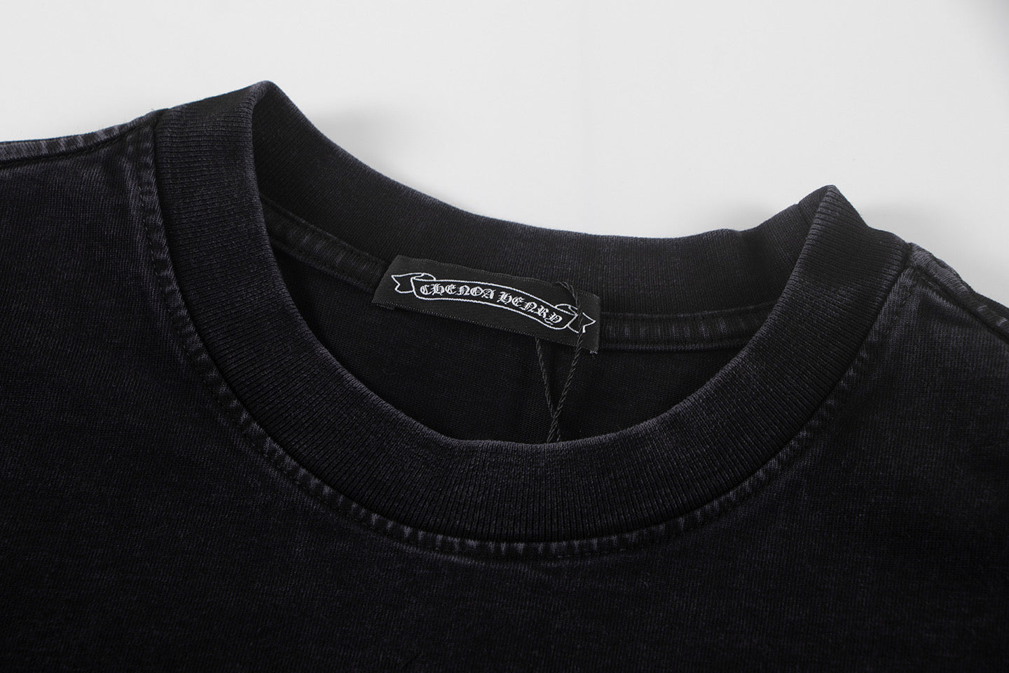 Black crewneck T-shirt with ribbed collar and brand neck tag