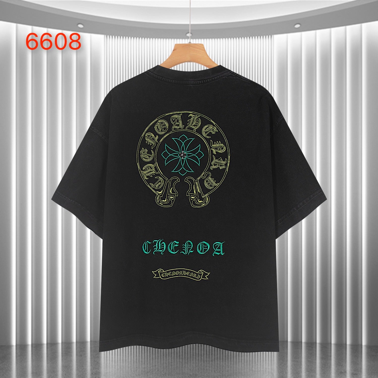 Black graphic T-shirt with large back skull emblem and teal and gold text