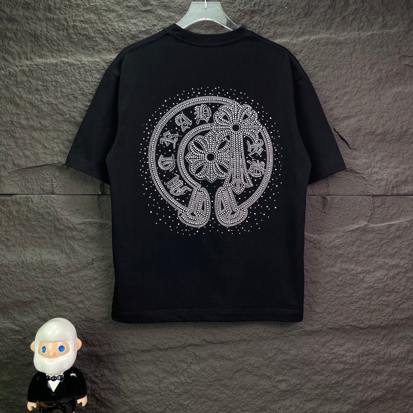 Black short-sleeve T-shirt with large rhinestone elephant graphic on back