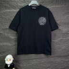 Black short-sleeve T-shirt with small circular rhinestone crest on chest