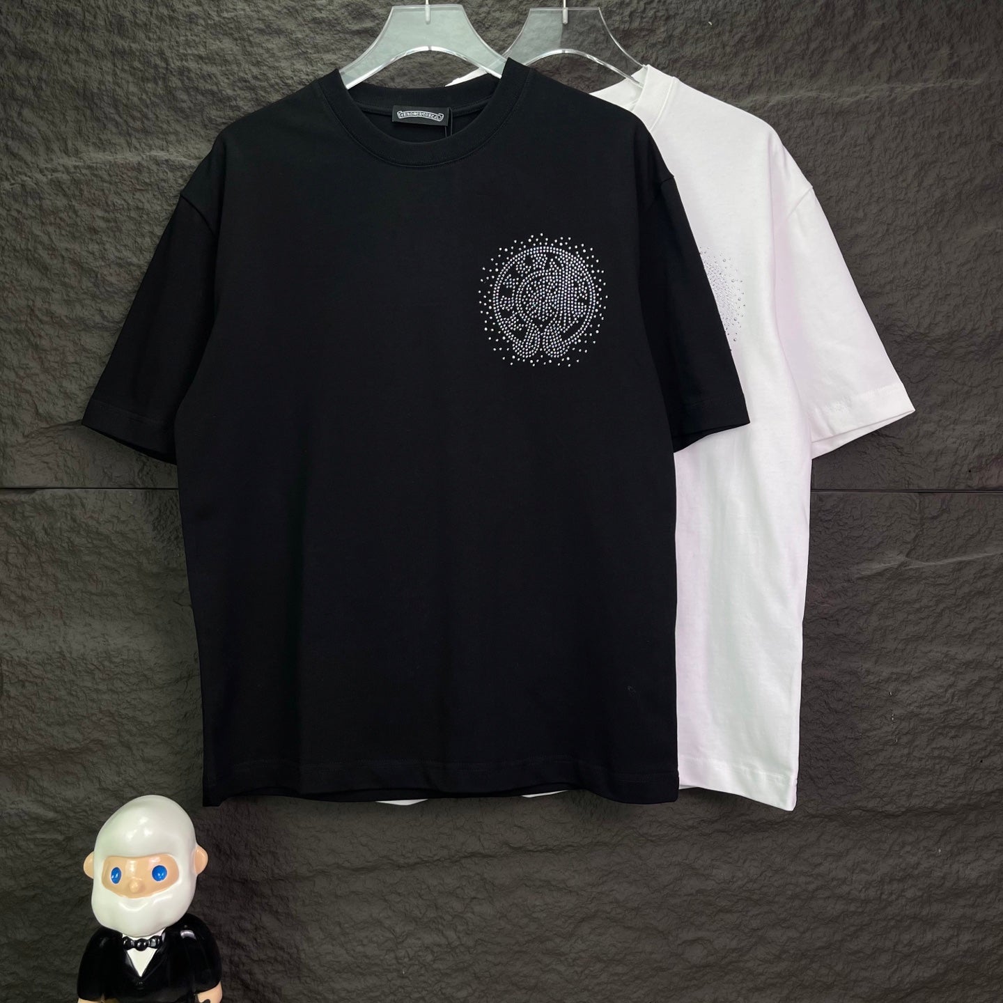 Black short-sleeve T-shirt with small rhinestone logo on the chest