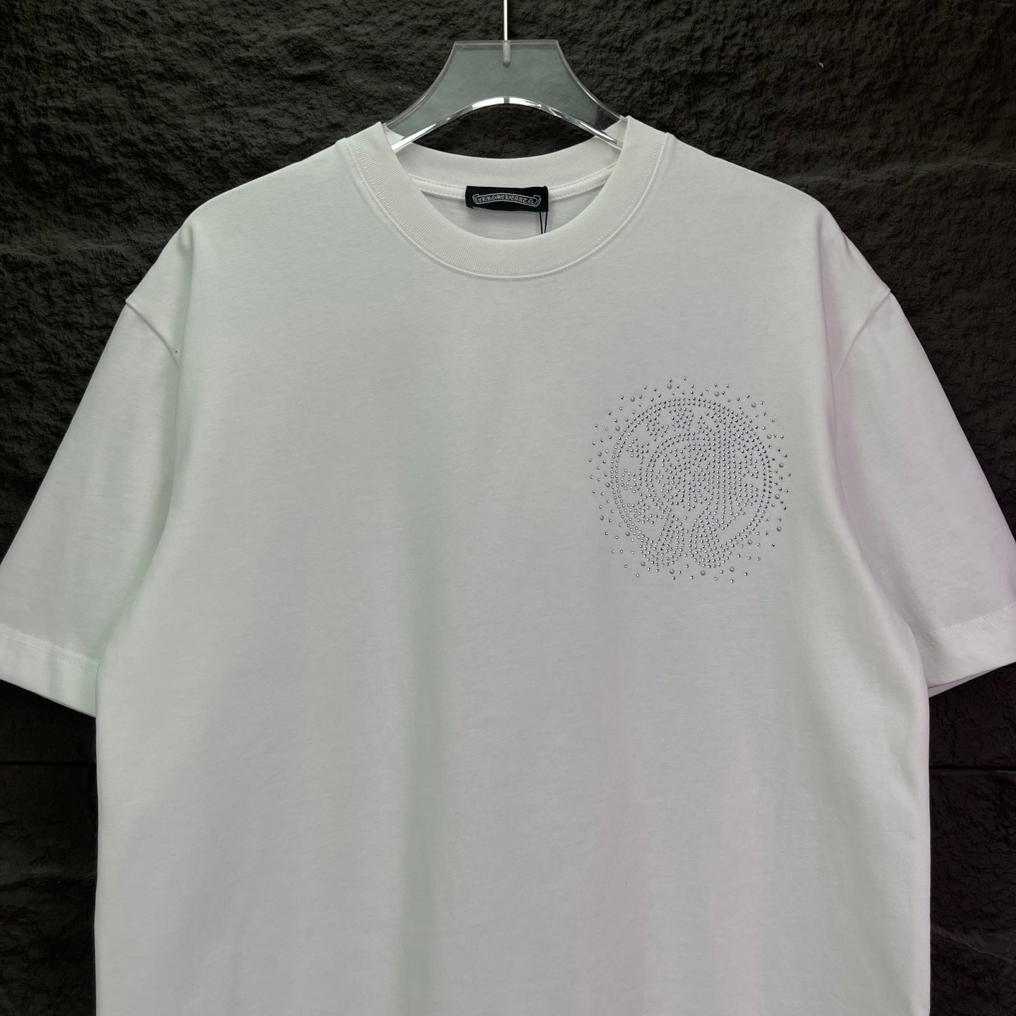 White short-sleeve T-shirt with small rhinestone logo on the chest