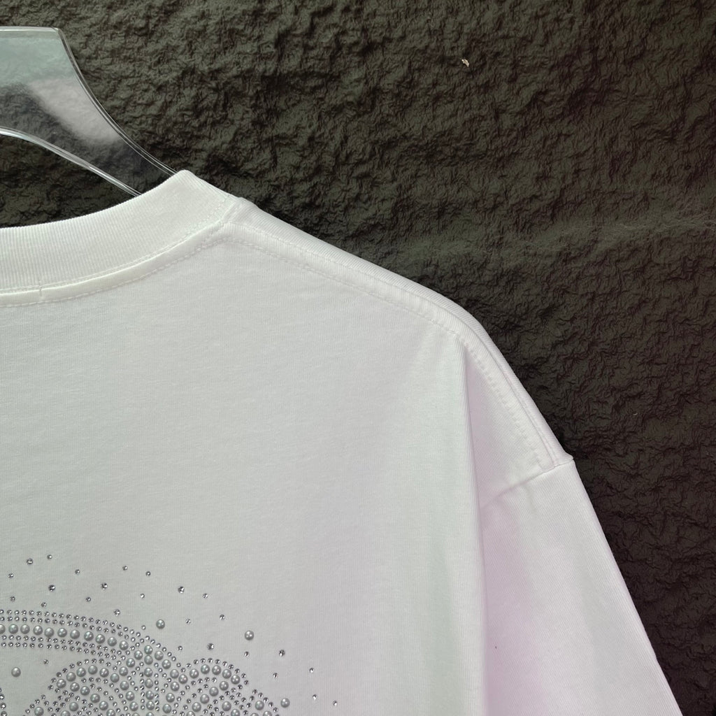 White short-sleeve T-shirt with rhinestone logo along the lower back