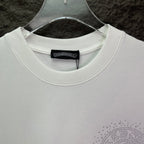 White crewneck T-shirt with ribbed collar and rhinestone logo at hem