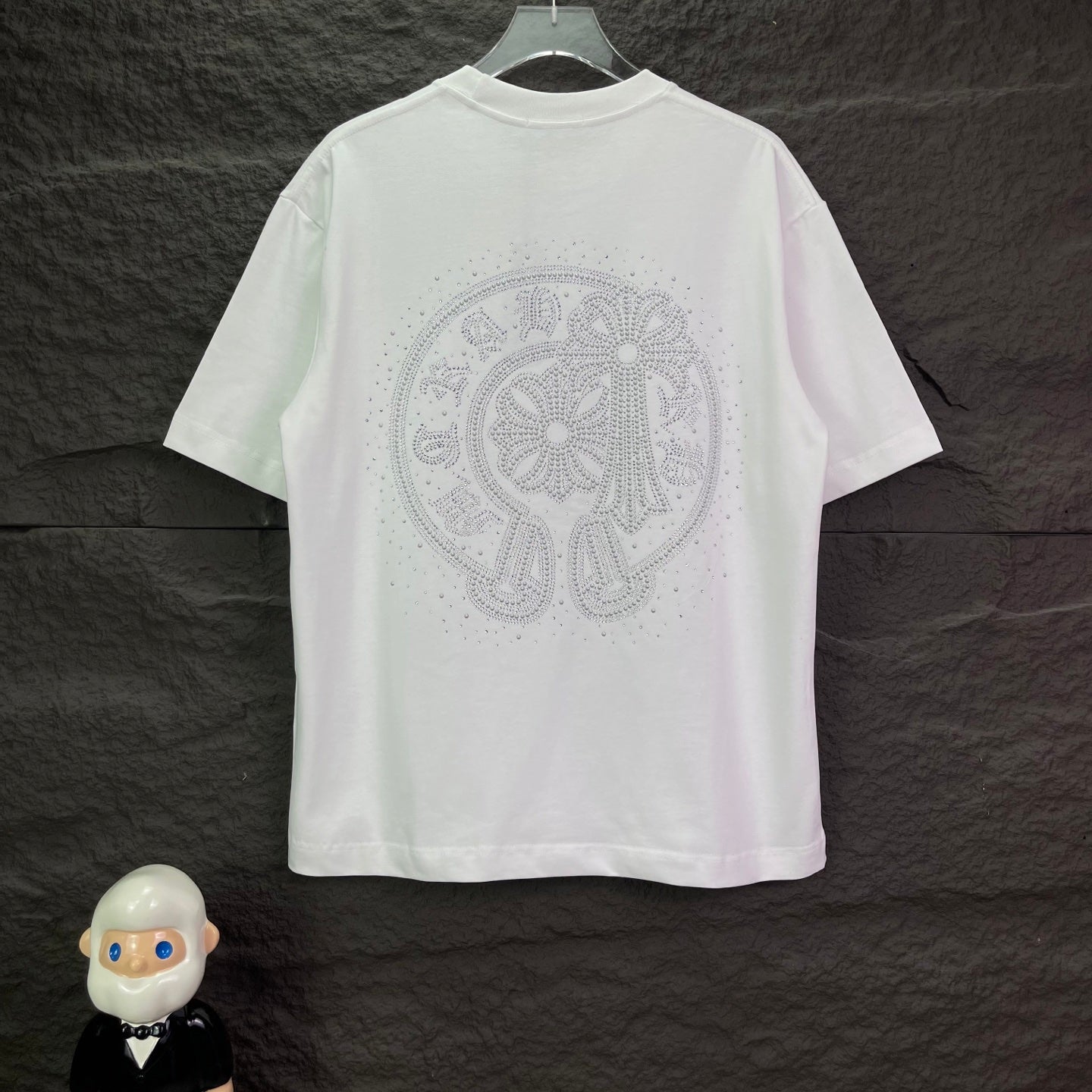 White short-sleeve T-shirt with large rhinestone emblem on the back