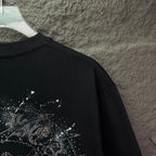 Black short-sleeve T-shirt with partial rhinestone graphic on upper back.