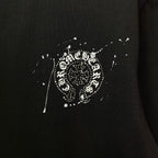 Black short-sleeve T-shirt with large rhinestone-style crest emblem print at center.