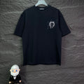 Black short-sleeve T-shirt with small rhinestone-style emblem on left chest.