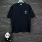 Black short-sleeve T-shirt with small rhinestone-style emblem on left chest.