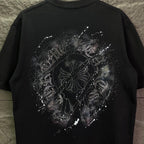 Black short-sleeve T-shirt with large rhinestone emblem graphic on back.