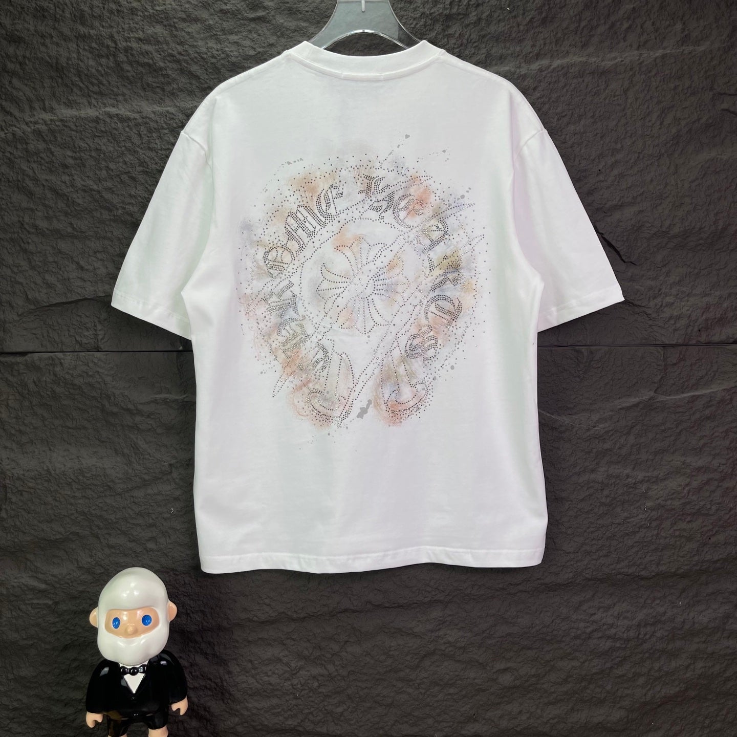 White crew-neck T-shirt with large jeweled crest graphic on back