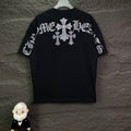 Black short-sleeve T-shirt with rhinestone cross motif across the back