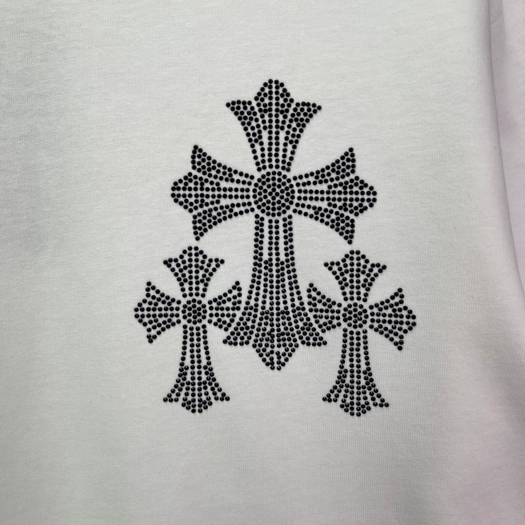 White T-shirt fabric close-up of black cross-studded graphic