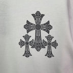 White T-shirt fabric close-up of black cross-studded graphic