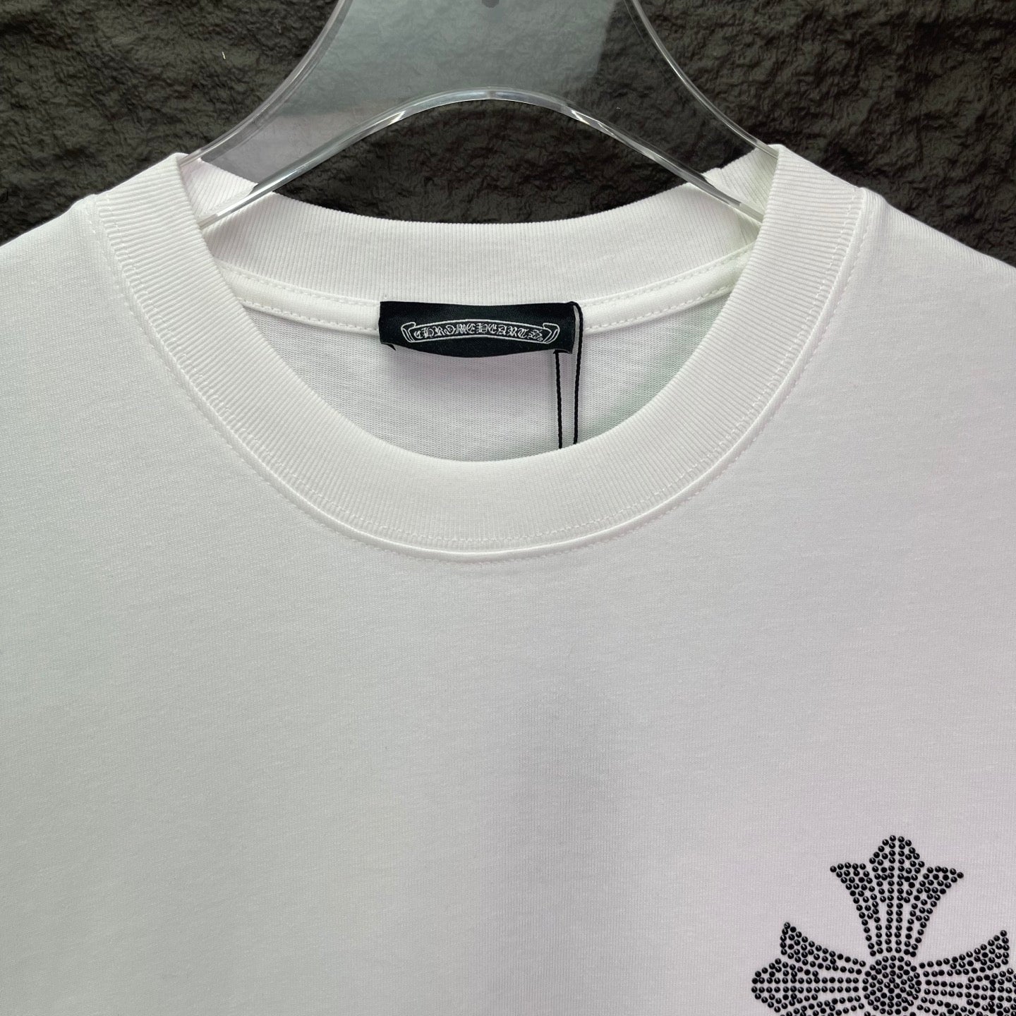 White crewneck T-shirt with ribbed collar and small cross logo