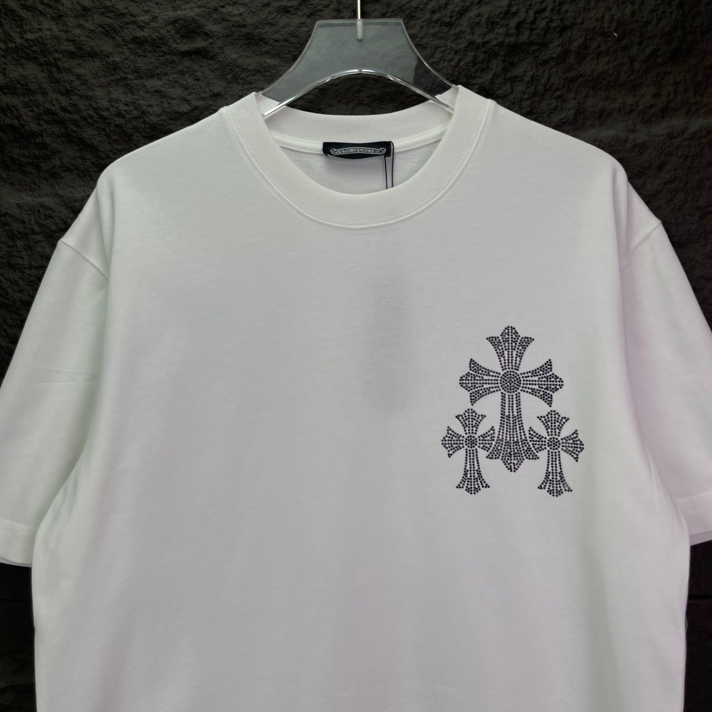 White short-sleeve T-shirt with small chest cross emblem