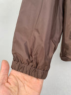 Brown jacket sleeve with elastic cuff and gathered hem