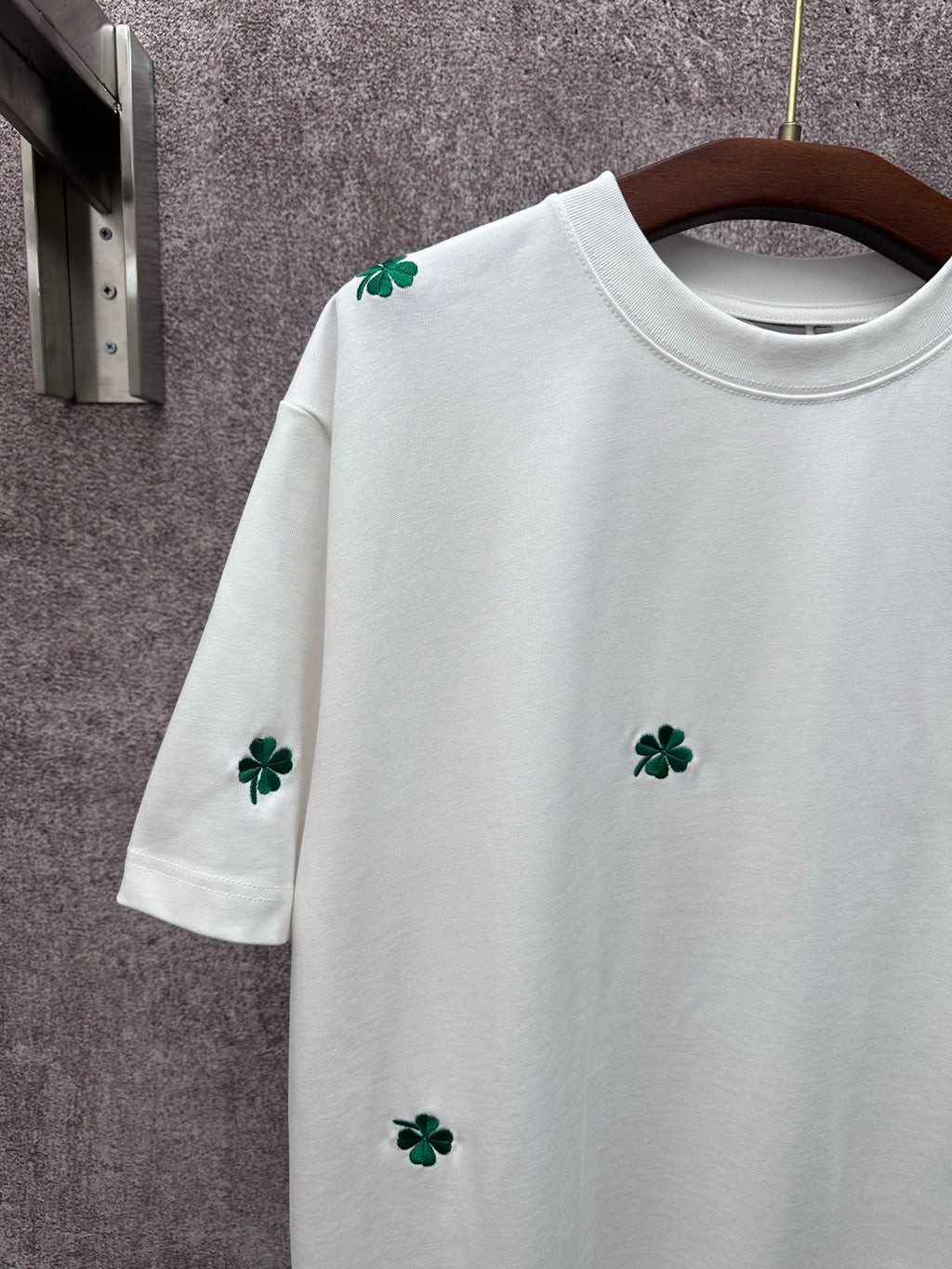 White long-sleeve-length? (No) White short-sleeve T-shirt with green clover embroidery