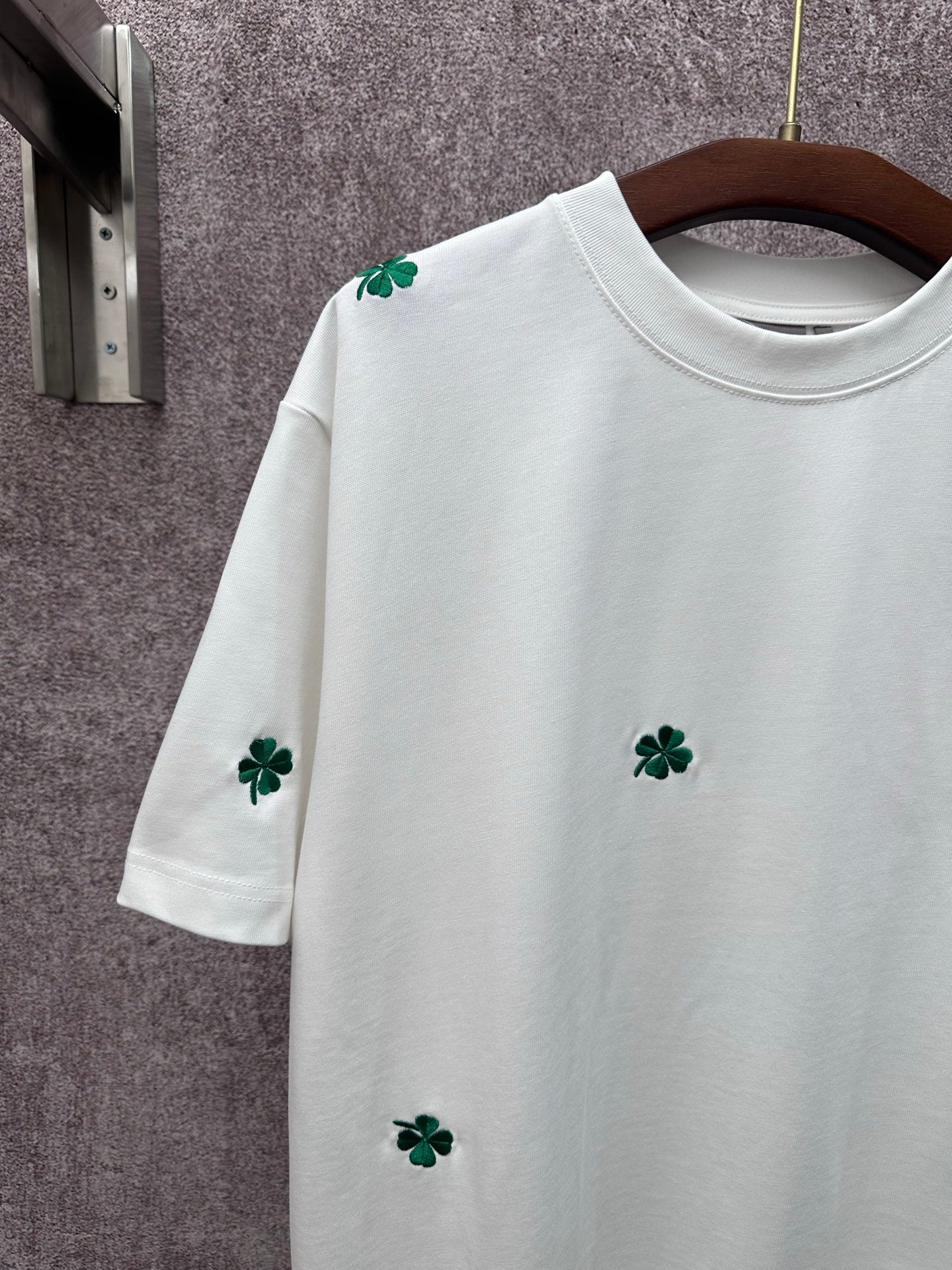 White long-sleeve-length? (No) White short-sleeve T-shirt with green clover embroidery