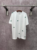 White short-sleeve T-shirt with green clover embroidery, crew neckline