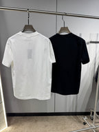 Back view of white and black Versace crewneck T-shirts on hangers