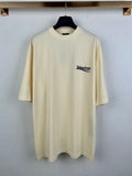 Light yellow Balenciaga crew-neck T-shirt with small chest logo